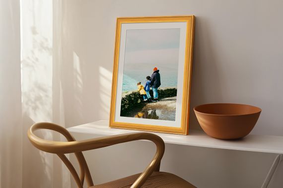 print of landscape in natural wood frame