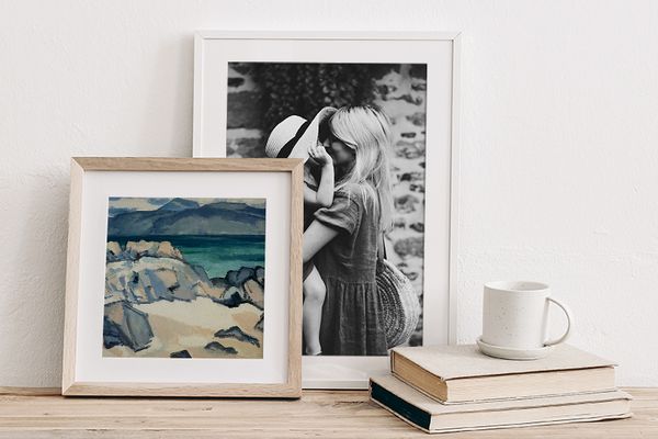 print of landscape in natural wood frame