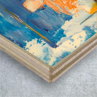 A canvas print hung behind in a foyer, behind a couch.