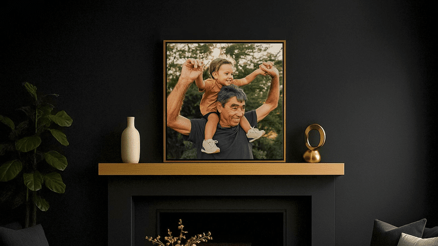 Framed photo of grandfather with grandchild on his shoulders in a dark room with gold accents and plants