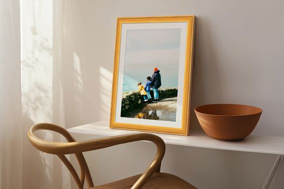 print of landscape in natural wood frame