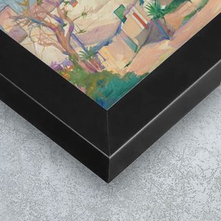 A canvas print hung behind in a foyer, behind a couch.