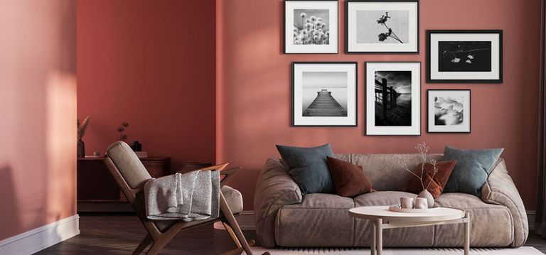 Black and white framed photographs in black picture frames in modern living room