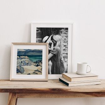 print of landscape in natural wood frame