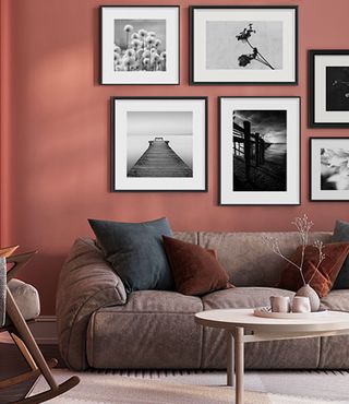 Black and white framed photographs in black picture frames in modern living room