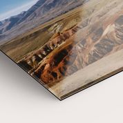 Acrylic print displaying mountainous desert landscape.