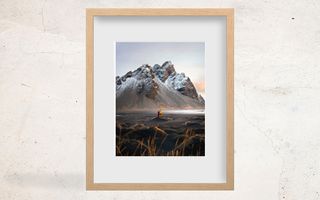 print of landscape in natural wood frame