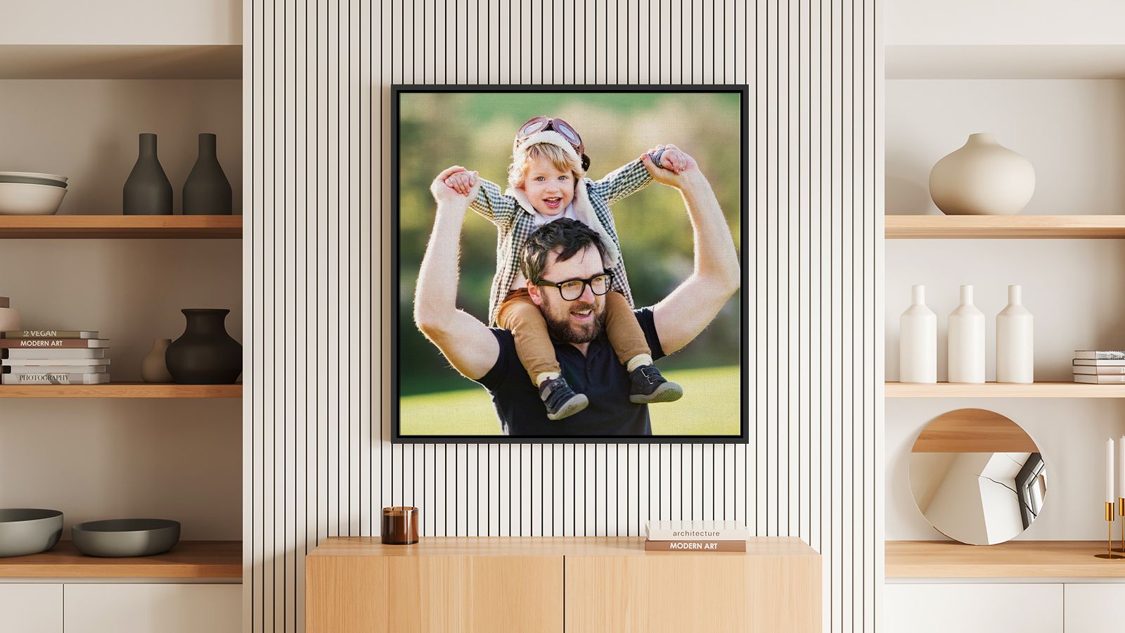 Framed photo of father and child in a bright room above a table with modern decor