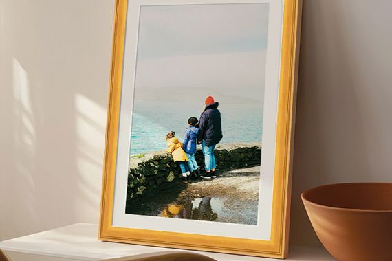 print of landscape in natural wood frame